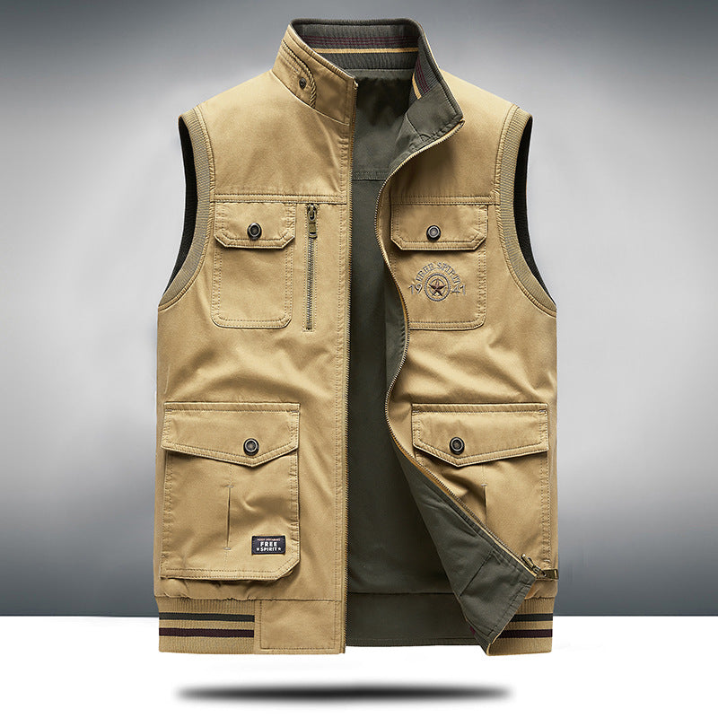 Black multi-pocket unisex utility vest, structured & modern, perfect for practical outerwear layering.