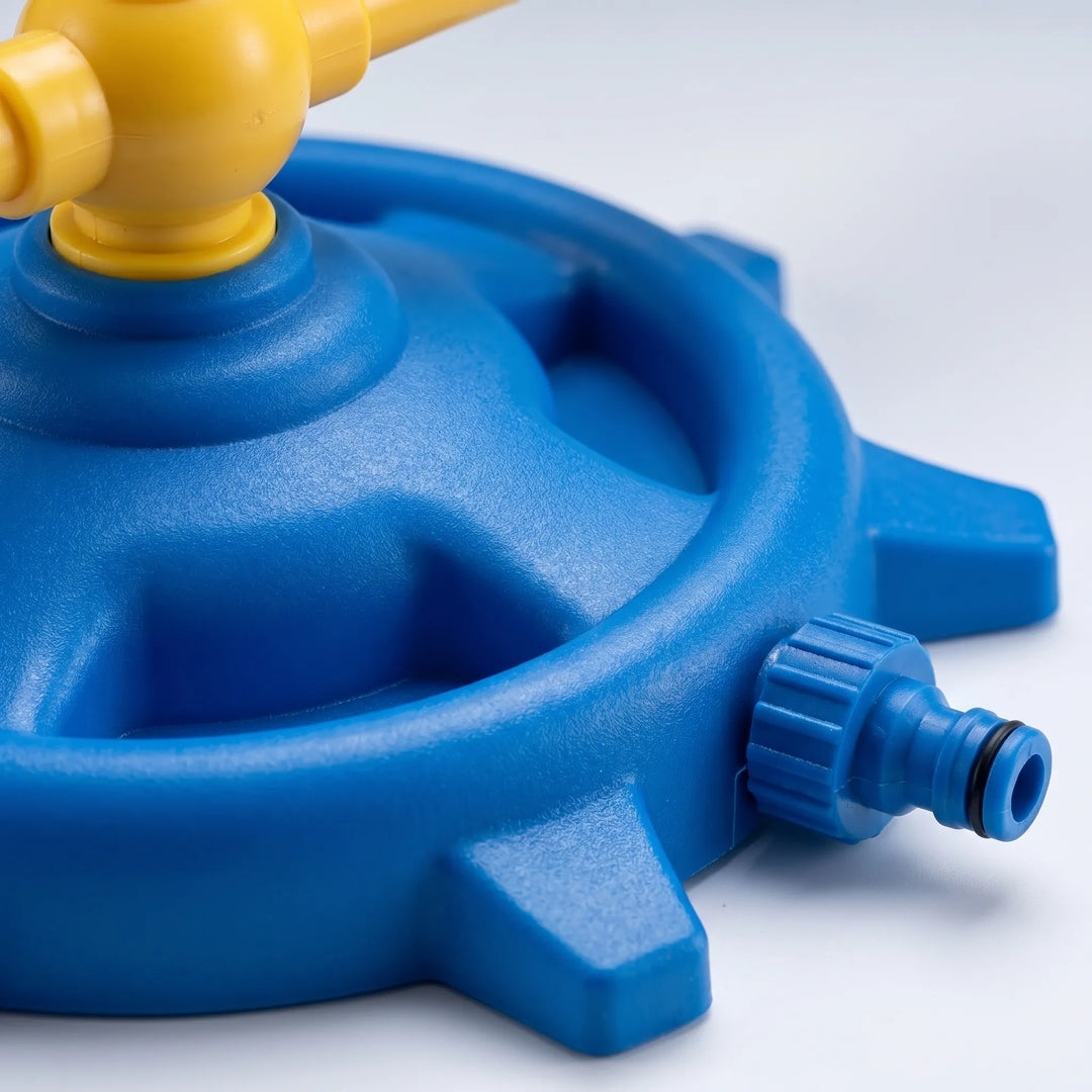 Vibrant spinning water sprinkler for kids, provides cool 360-degree outdoor summer fun in the backyard.