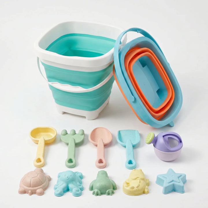 Colorful kids' outdoor beach toy play set with collapsible bucket, shovel & sand molds. Perfect for summer travel.