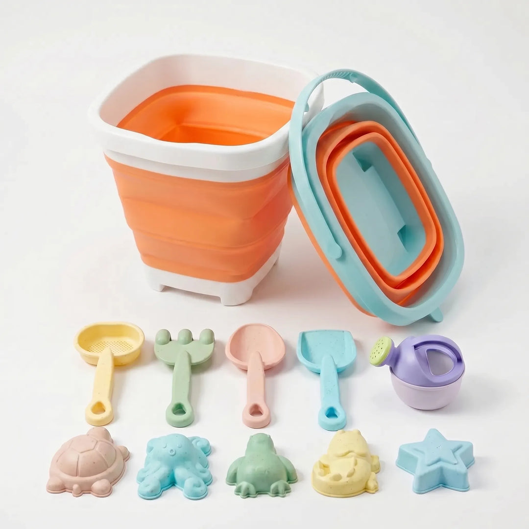 Travel-friendly kids' beach toy set featuring a collapsible silicone bucket, sand tools & molds for outdoor play.