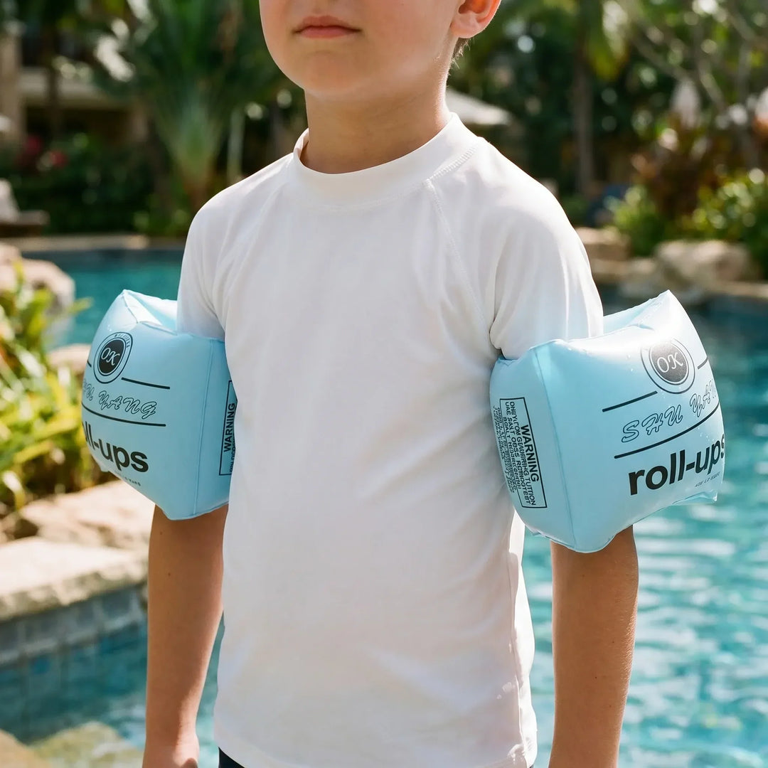 Kids' inflatable swim armbands for pool and beach, ensuring water safety for children.