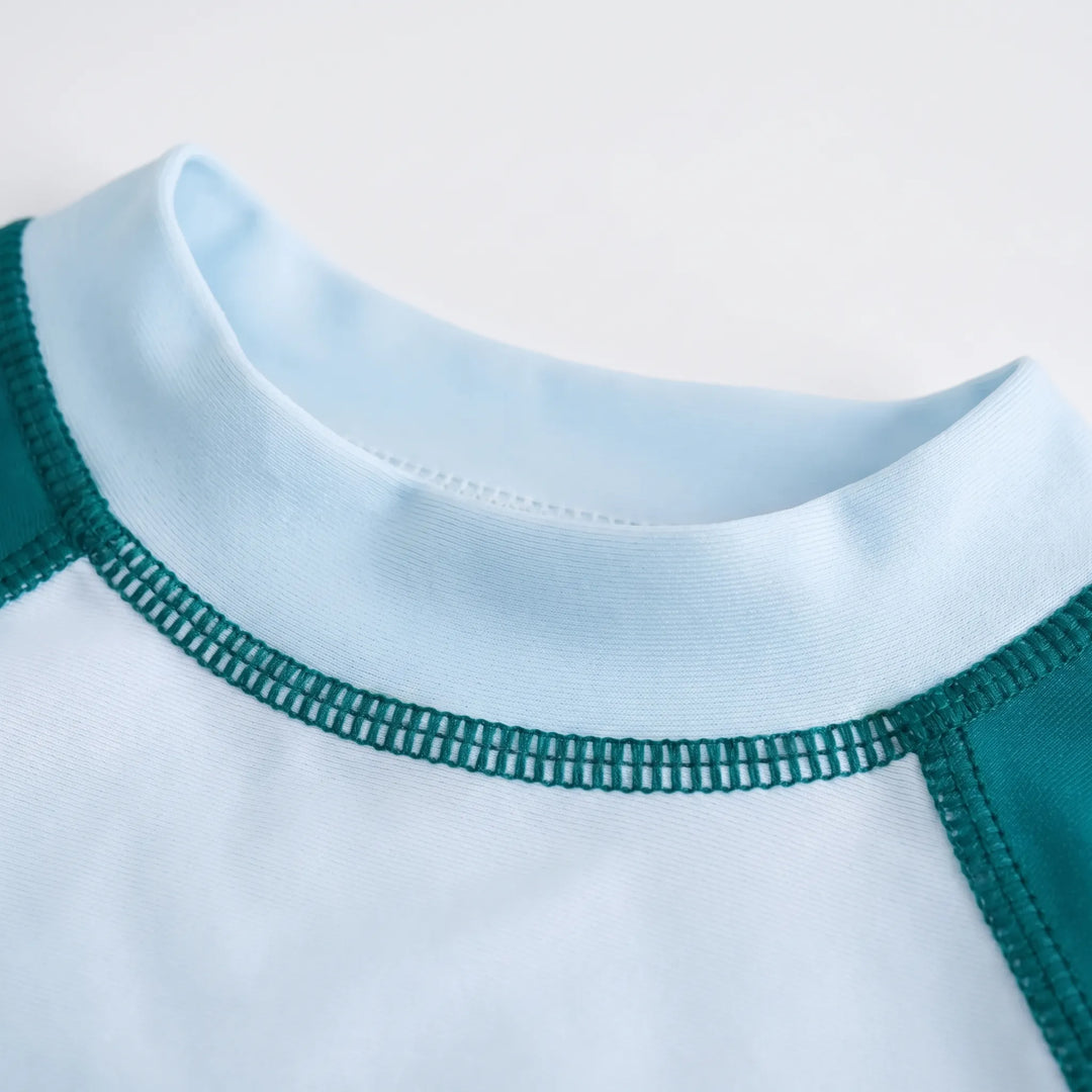 Toddler two-piece long-sleeve rash guard swimsuit, offering UV sun protection for pool days.