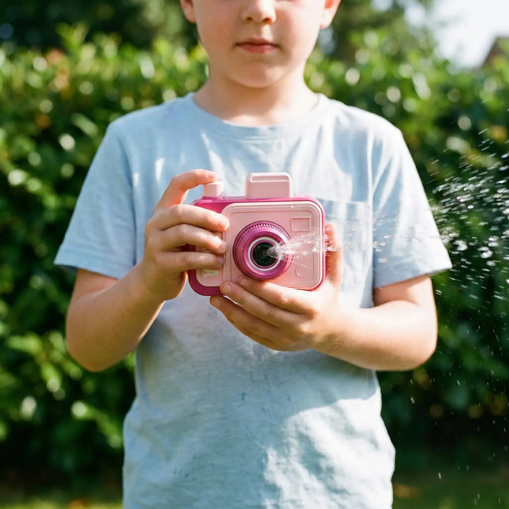 Kids' novelty water squirt camera toy for summer outdoor fun. A fun beach and party favor water gun for children.