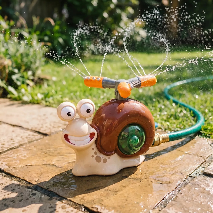 Cute snail water sprinkler toy for kids. Connects to garden hose for backyard summer water play.
