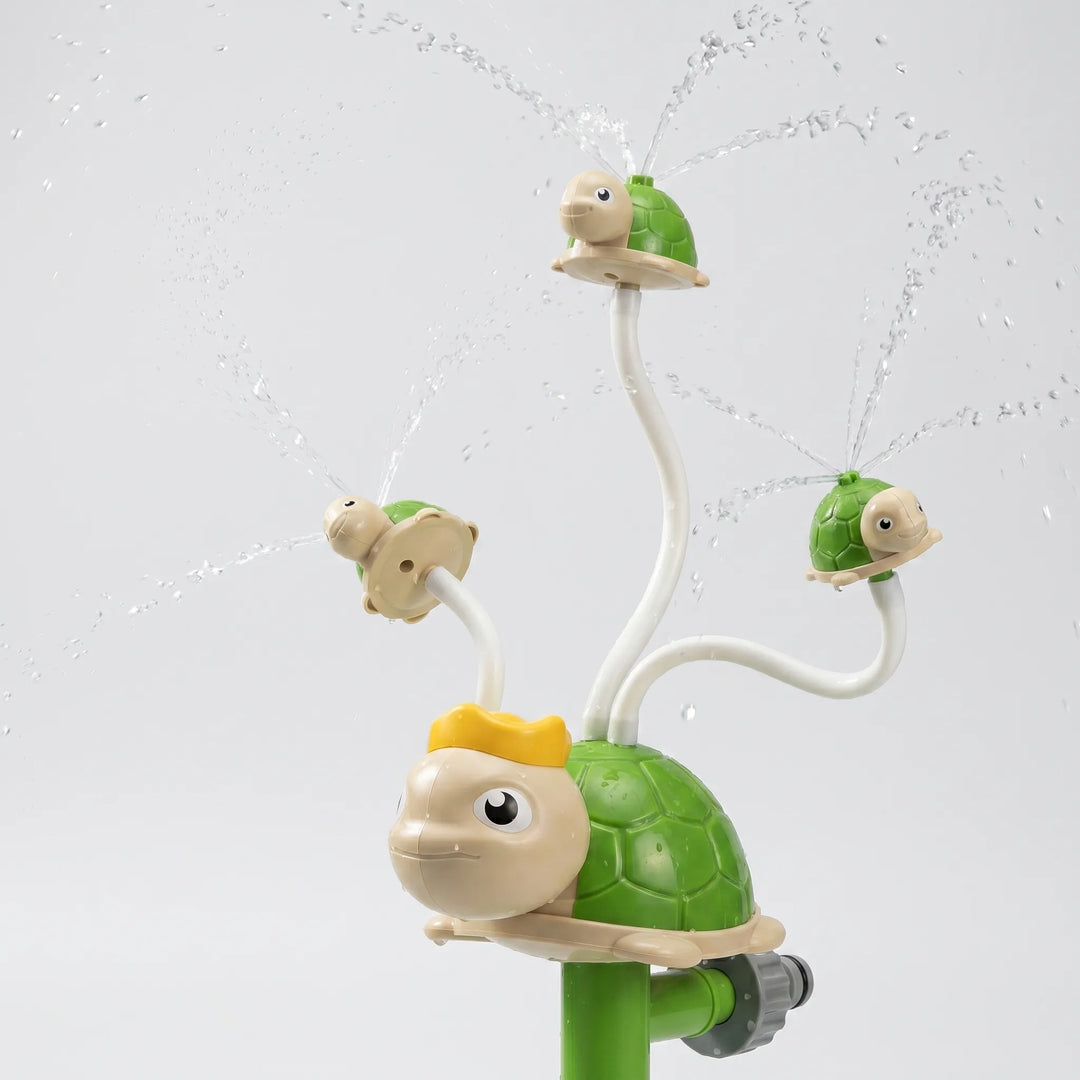 Colorful children's spinning water sprinkler creating a playful fountain for garden playtime.