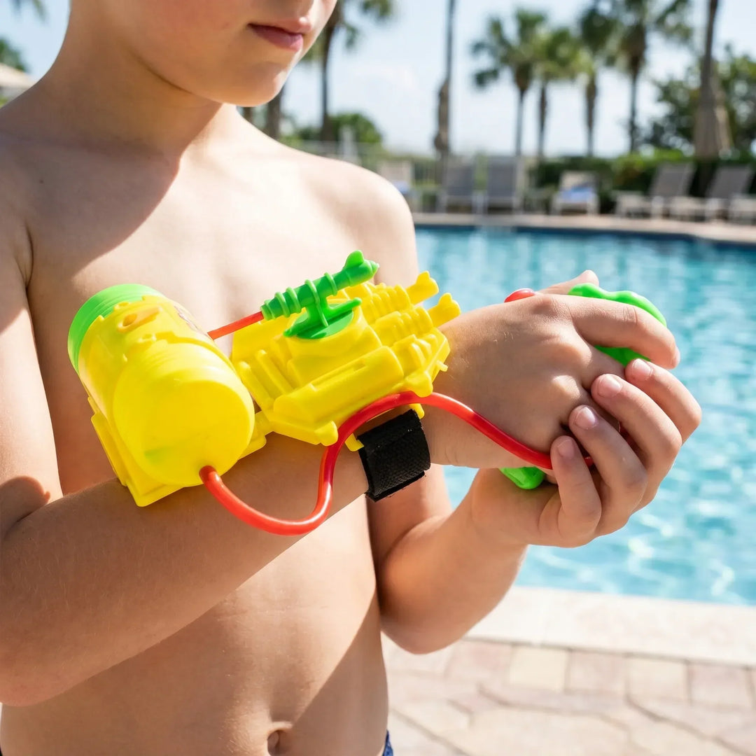 Child with wrist-mounted water toy, ready for hands-free water fun at the beach, pool, or outdoor summer play.