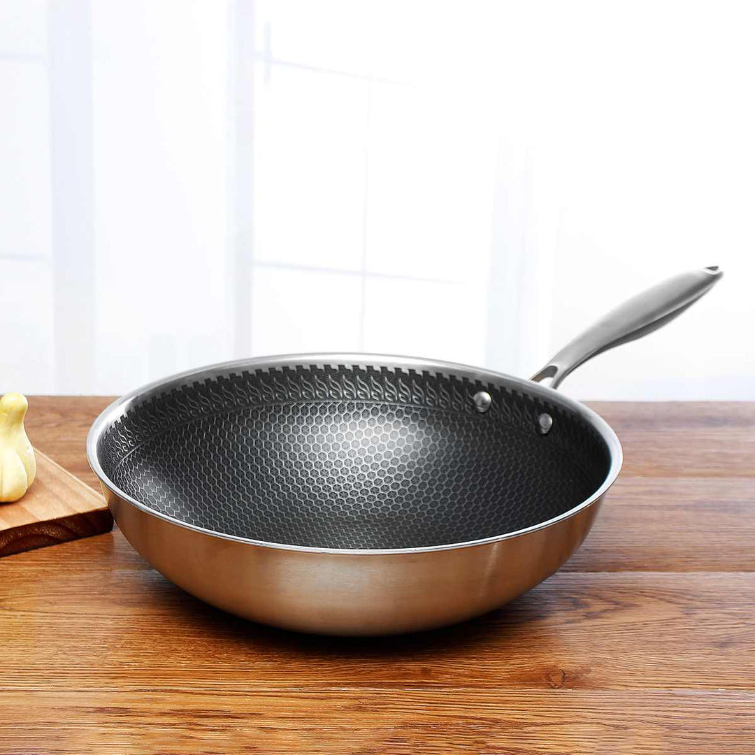 Kitchen's stainless steel non-stick frying pan for versatile, easy cooking. Durable cookware.