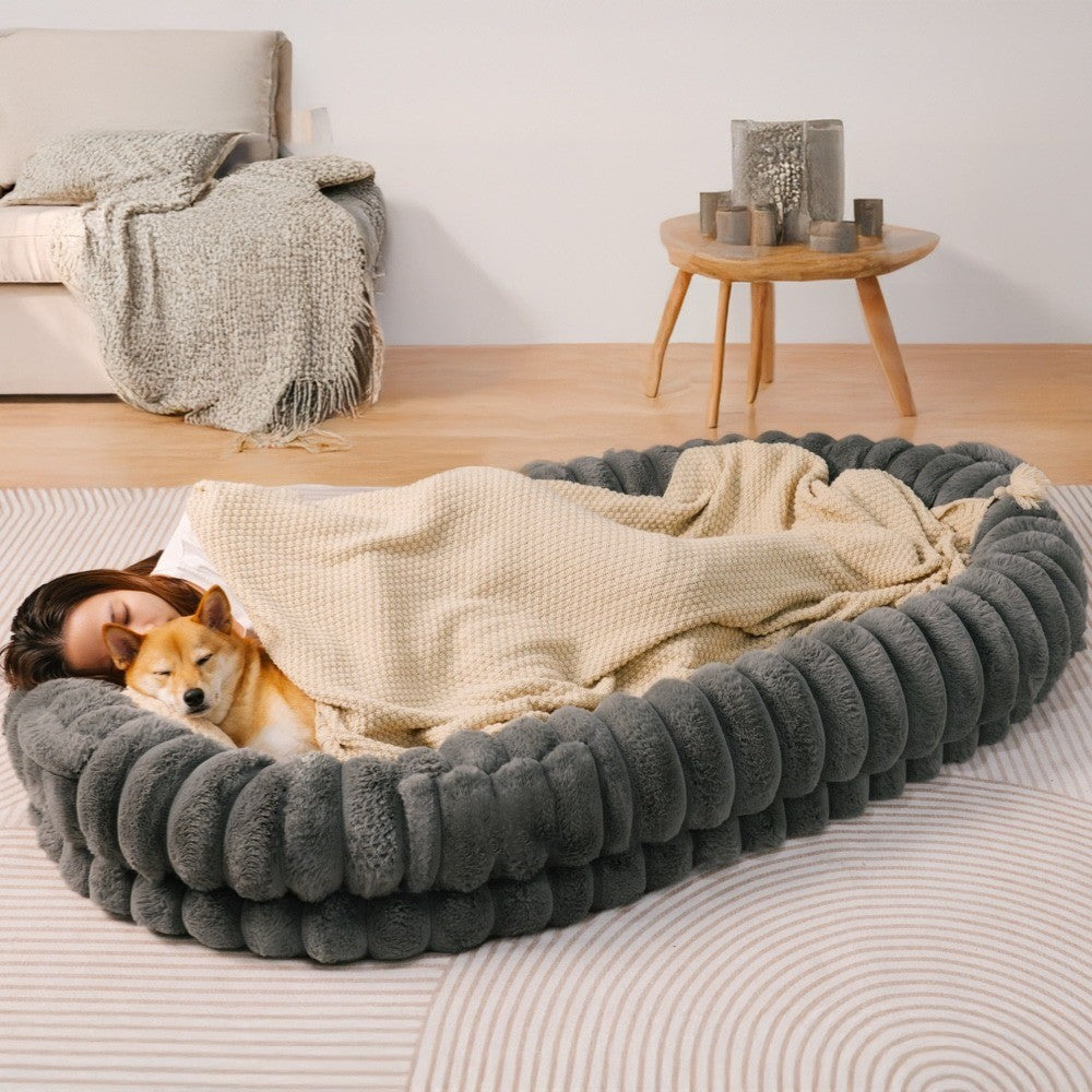 Unisex calming donut bed, plush, supportive design for pets and owners, ideal for indoor use