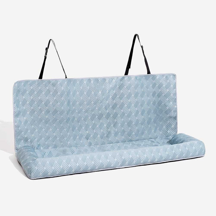 Easy clean pet travel bolster car seat with cooling features, promoting dog comfort and vehicle safety.