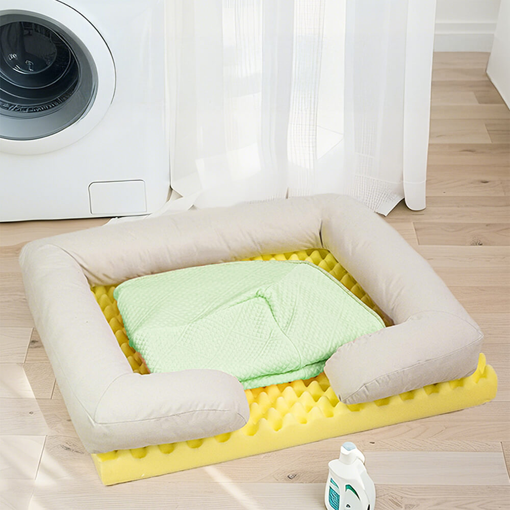 Happy large dog resting comfortably on a bolstered orthopedic cooling dog bed, full view.