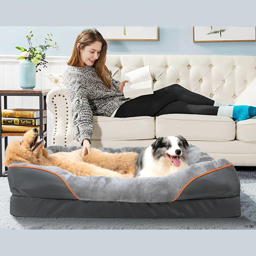 Grey orthopedic dog bed for pet comfort, featuring a waterproof base and washable design