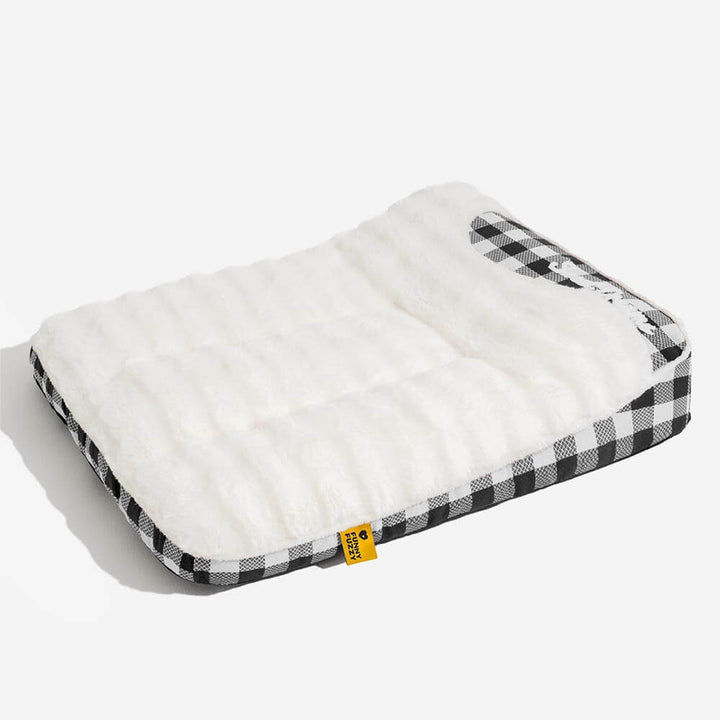 Therapeutic plaid dog bed with a comfortable headrest, promoting restful sleep for anxious pets