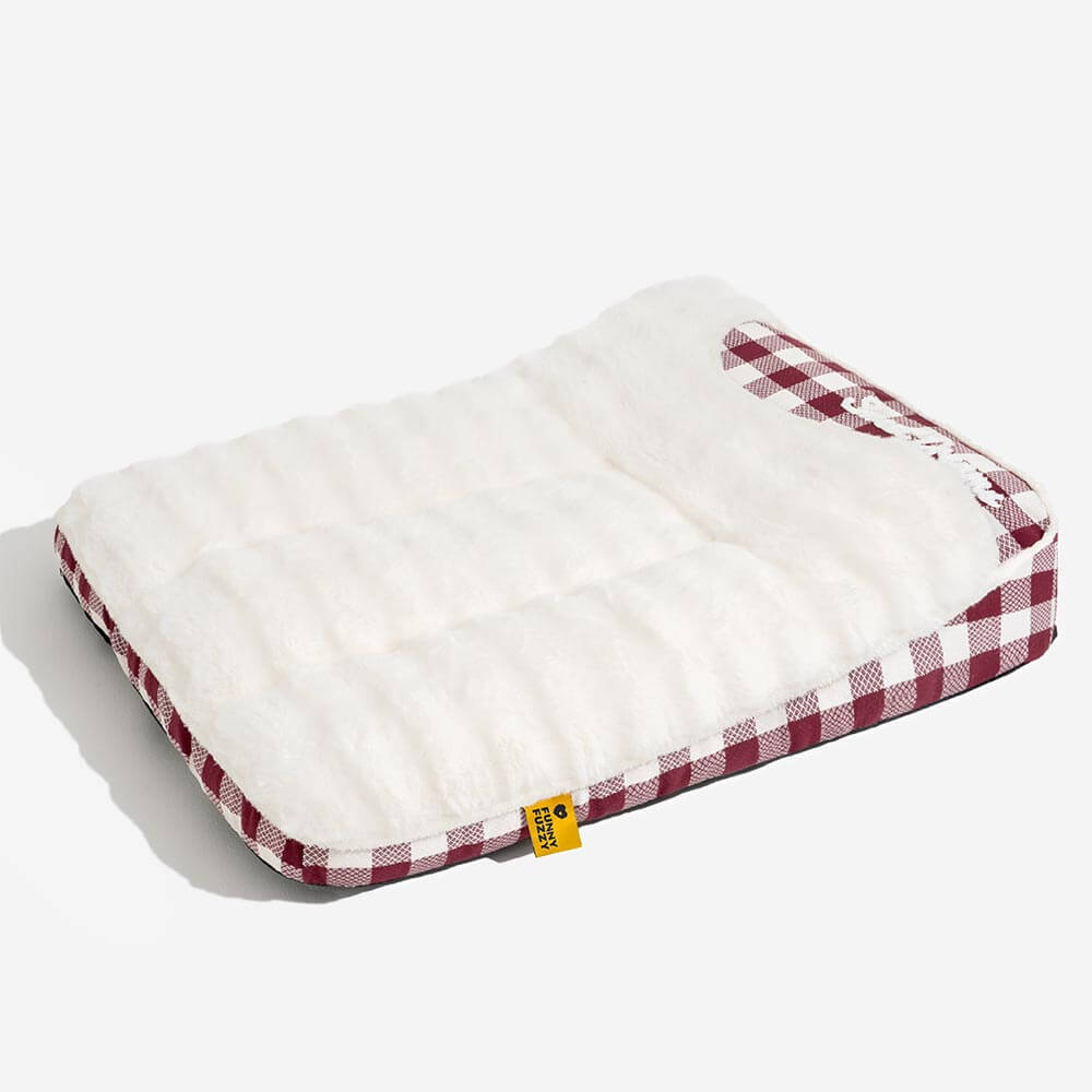 Cozy plaid dog bed with a headrest, offering a personal sanctuary for pet calming and rest