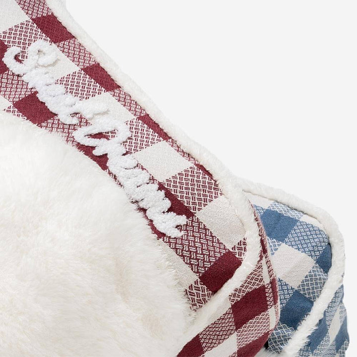 Large calming plaid dog bed, featuring a cozy headrest for ultimate pet relaxation and sleep