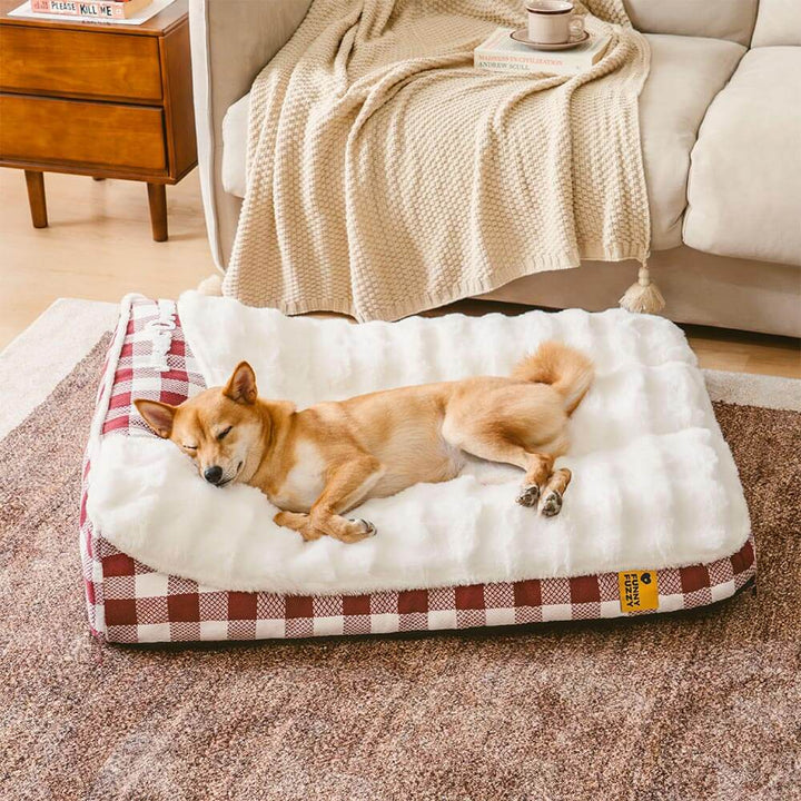 Dog bed with a stylish plaid pattern and integrated headrest for advanced pet comfort and calm