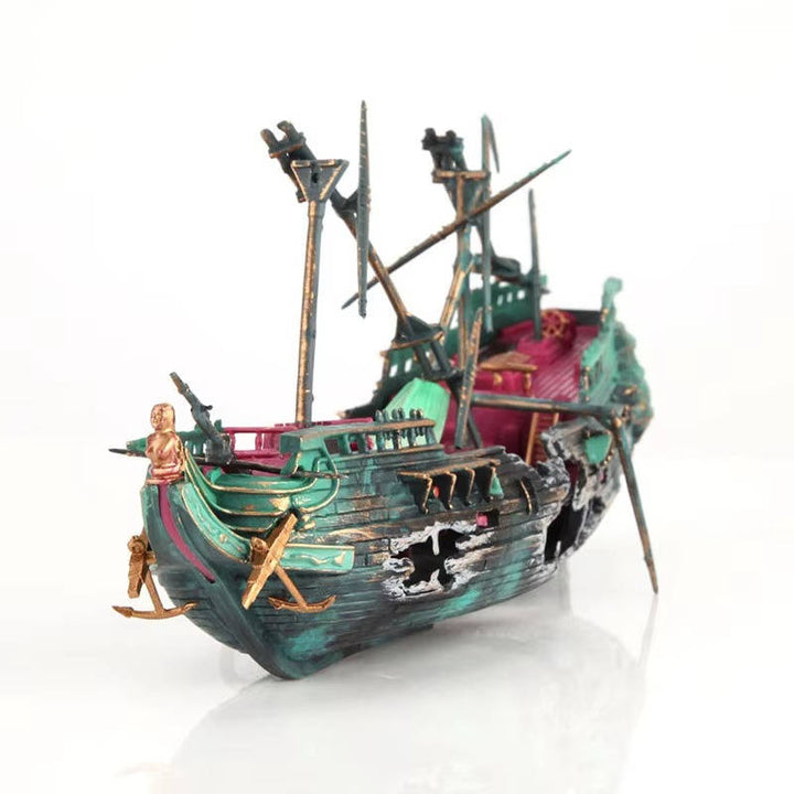 Close-up of the stern of a large sunken shipwreck aquarium decoration, showing intricate details