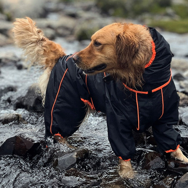 Large waterproof dog raincoat in red, adjustable for unisex pets, with reflective strips for safety.