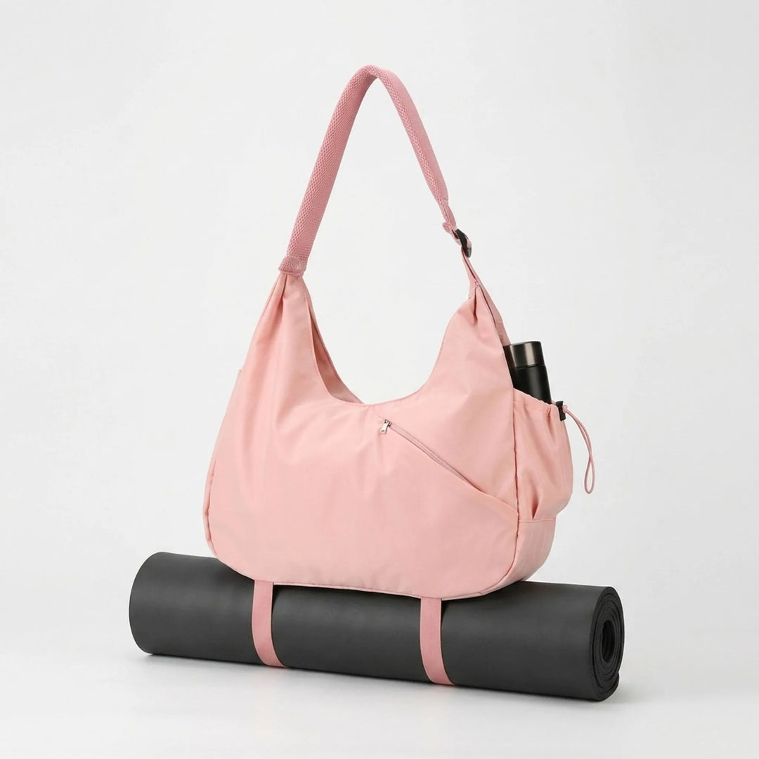 Stylish pink & black women's gym tote bag with yoga mat holder & organized pockets for all workout essentials.
