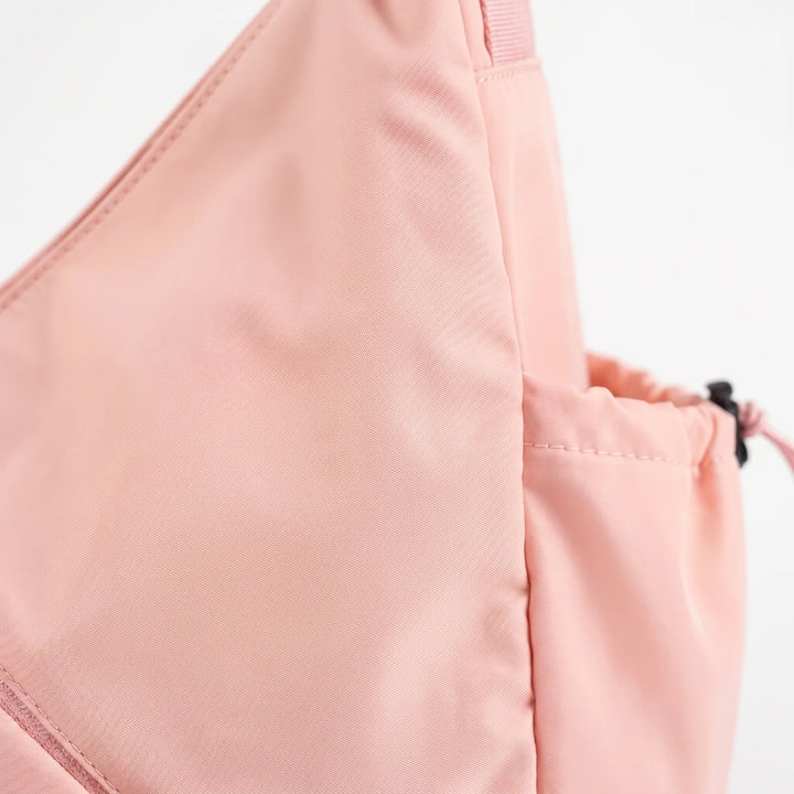 Durable women's sports shoulder bag, ideal for travel & activewear, featuring comfy straps & yoga mat holder.