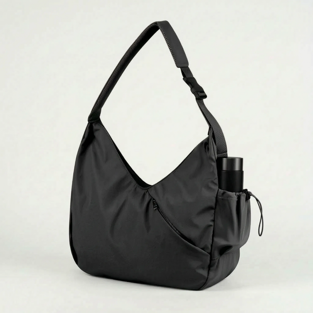 Women's large activewear tote bag with integrated yoga mat straps, perfect for fitness, gym, and daily carry.