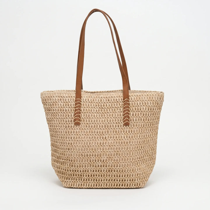 Chic large woven handbag for women, a spacious beach tote with zipper, great for summer and market trips.