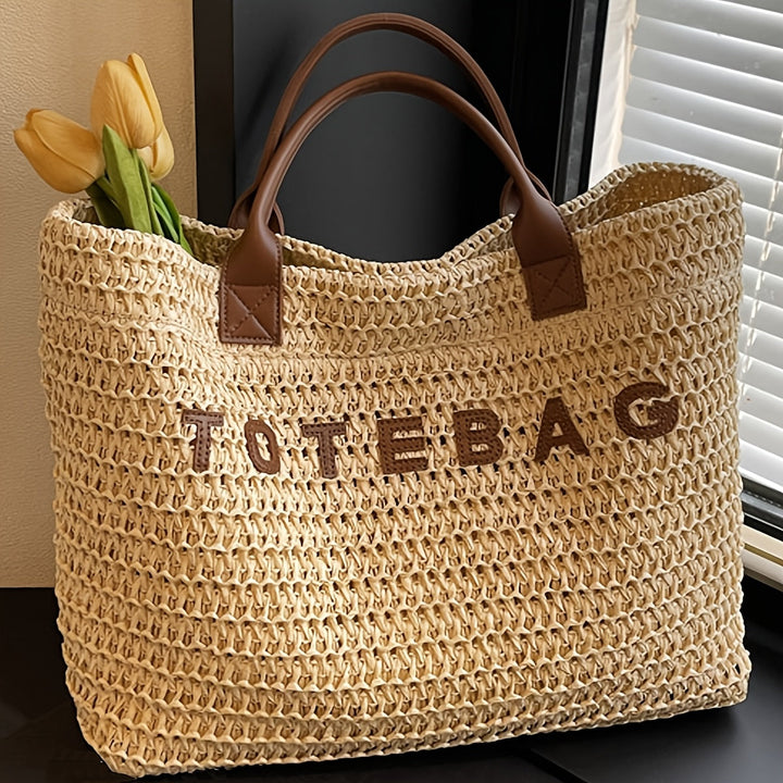 Chic green woven shoulder bag with luxurious leather handles, perfect for spring outings.