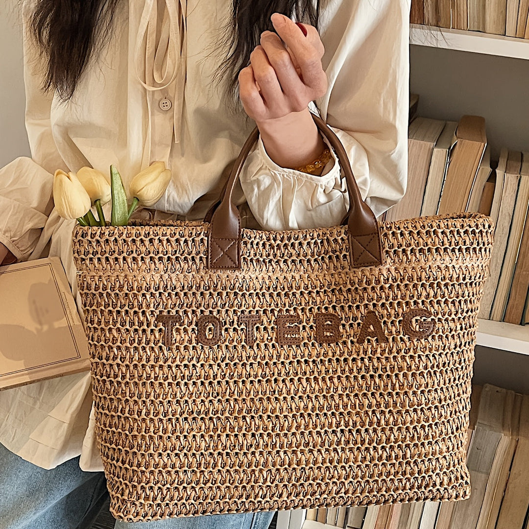 Classic beige woven tote bag with strong leather handles, suitable for work or leisure.