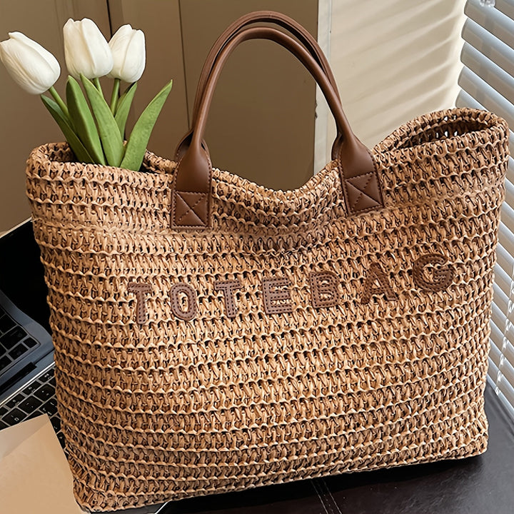 Spacious khaki woven shoulder bag with comfortable leather straps, perfect for travel.