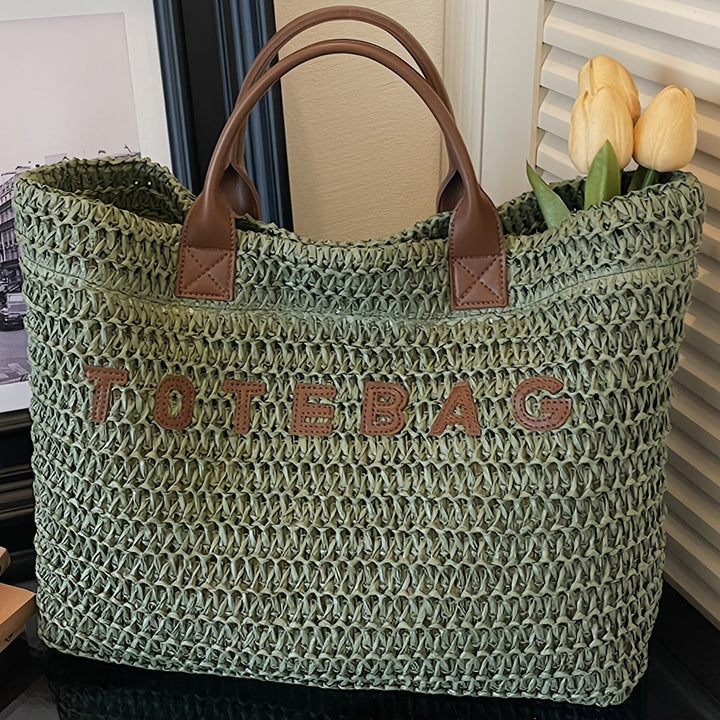 Textured green woven travel bag, a stylish shoulder bag with strong leather handles.