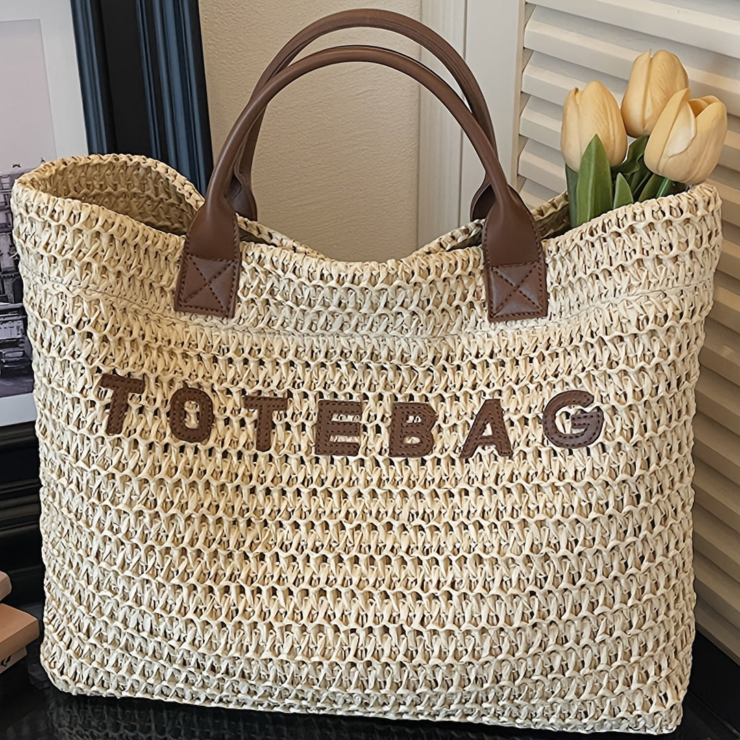Women's stylish woven shoulder bag, a large tote with natural texture and leather accents.