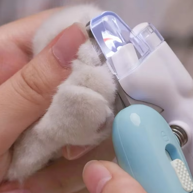 Ergonomic LED pet nail clippers with light for safe and precise dog and cat nail care.