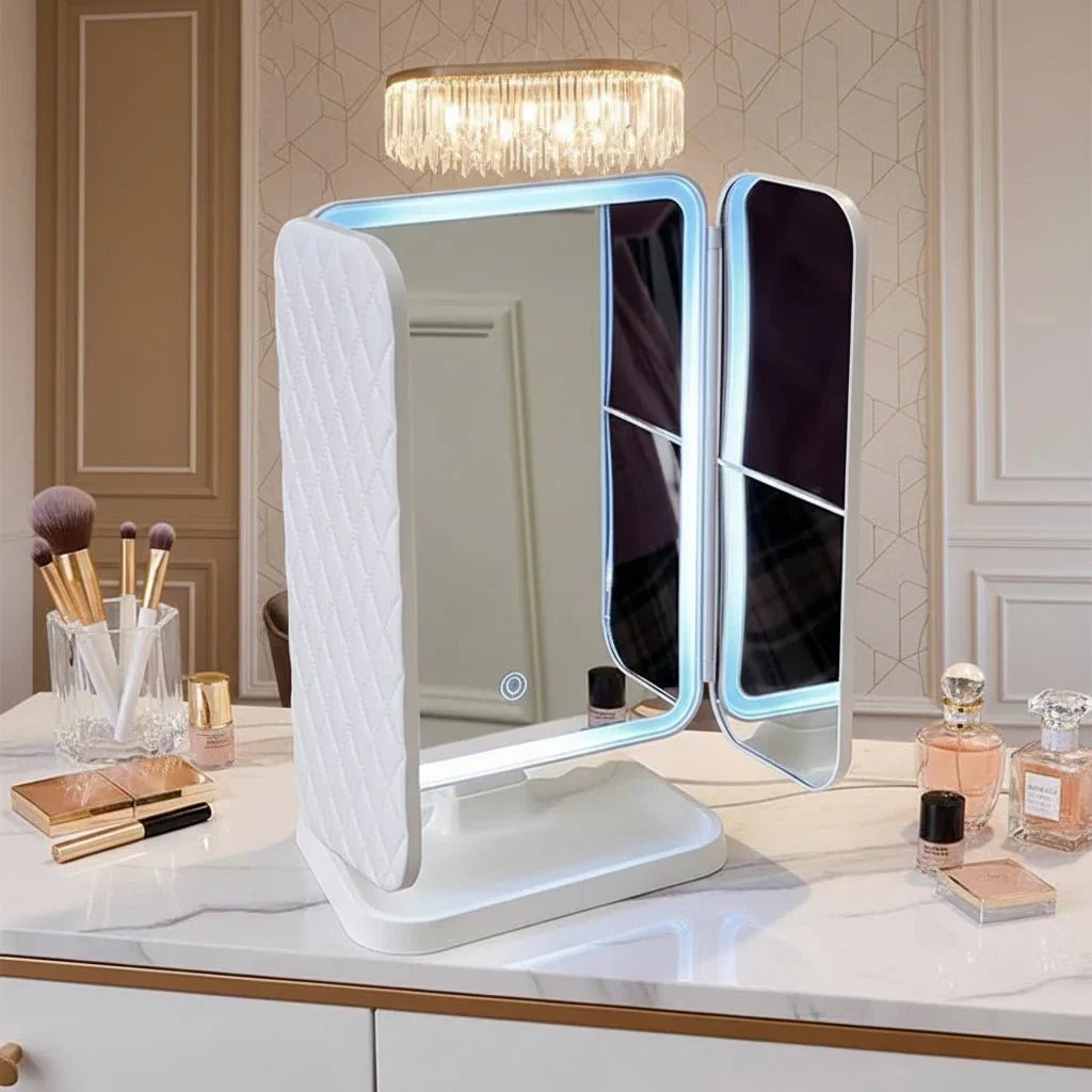 Portable LED tri-fold vanity mirror for dressing table, offering 3 light colors for accurate beauty application.