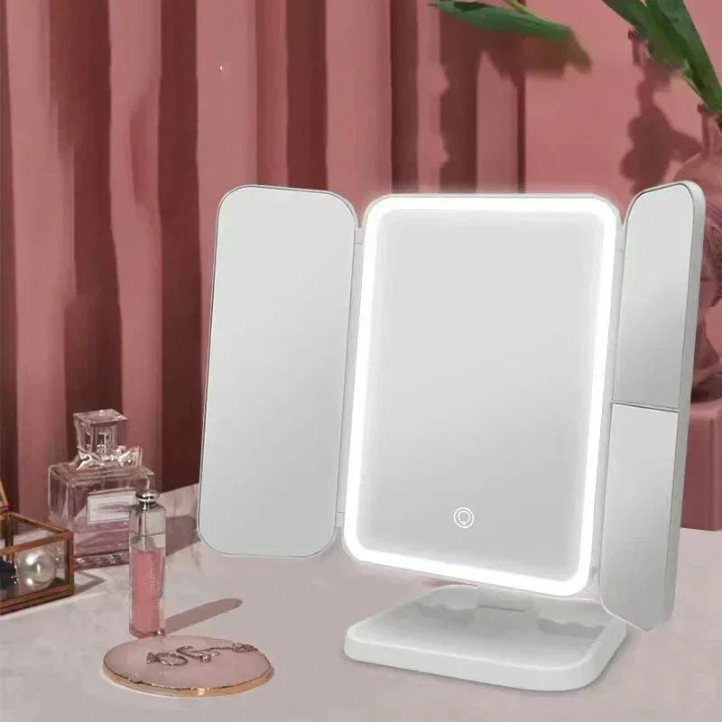 Modern LED vanity mirror, tri-fold design with 3 light settings, enhancing any dressing table or beauty space.
