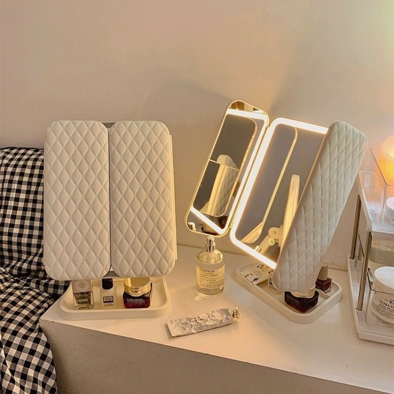 Illuminated cosmetic tri-fold mirror with LED lights & 3 color modes, ideal for detailed makeup application.