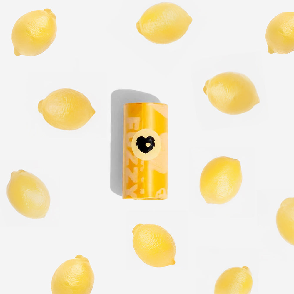 Stack of eco-friendly lemon scented pet poop bag rolls, convenient dog accessories
