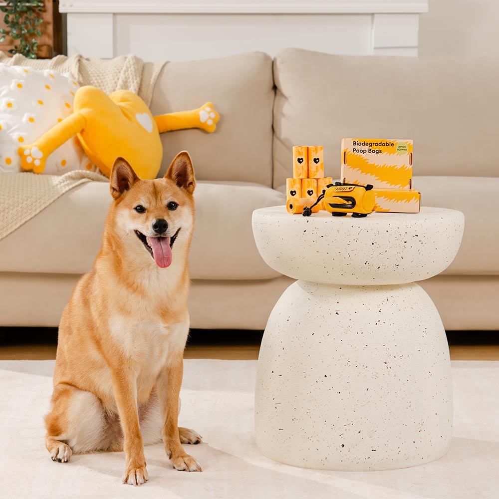 Packaging of lemon scented biodegradable dog poop bags, featuring eco-friendly branding