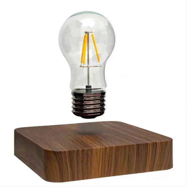 Unique floating light bulb lamp with a sophisticated walnut wood base, creating magical levitating home decor ambiance.