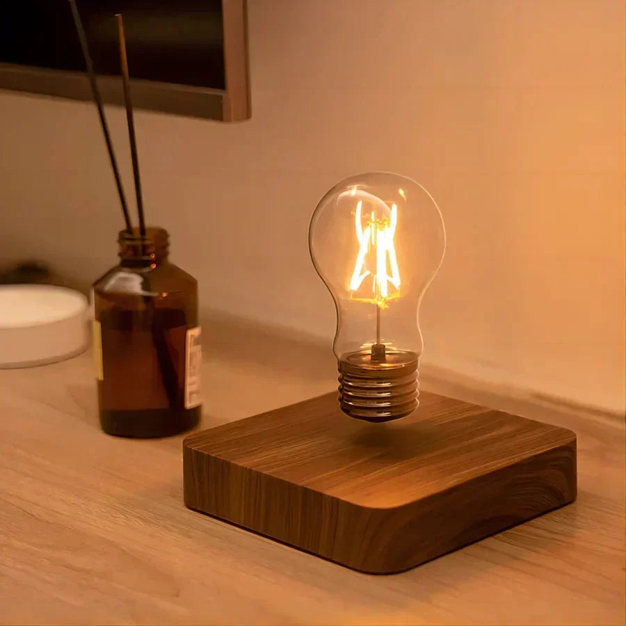 Innovative levitating desk lamp, featuring a walnut base & floating bulb, ideal for modern home decor and unique gifts.