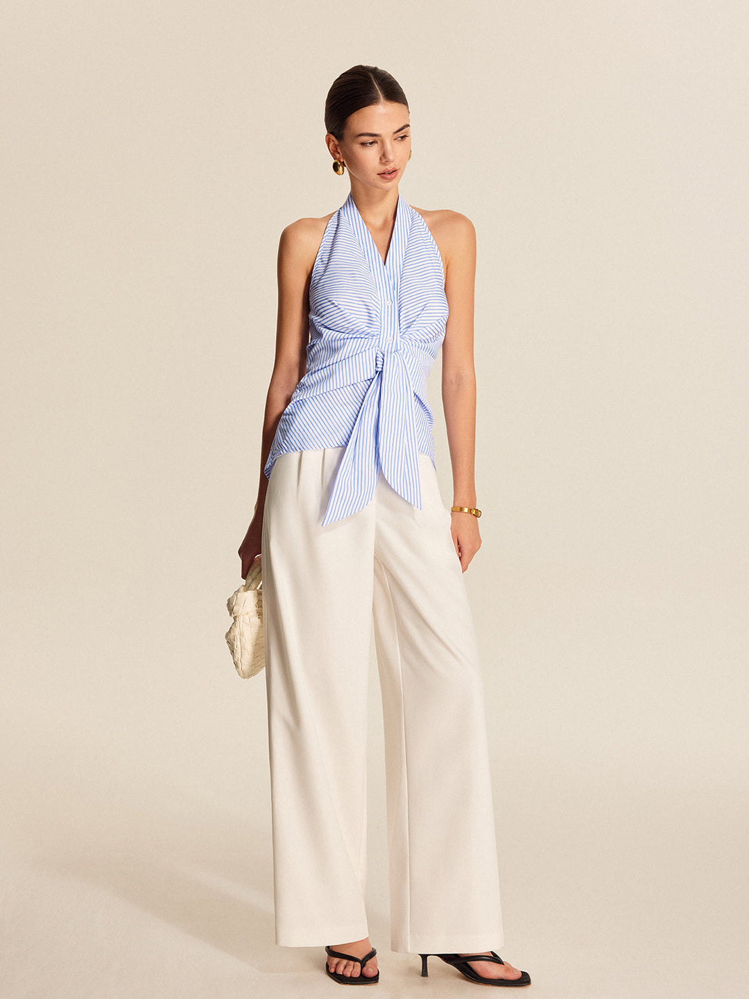 Professional light blue striped halter tie-front blouse, ideal for office attire and stylish workwear.