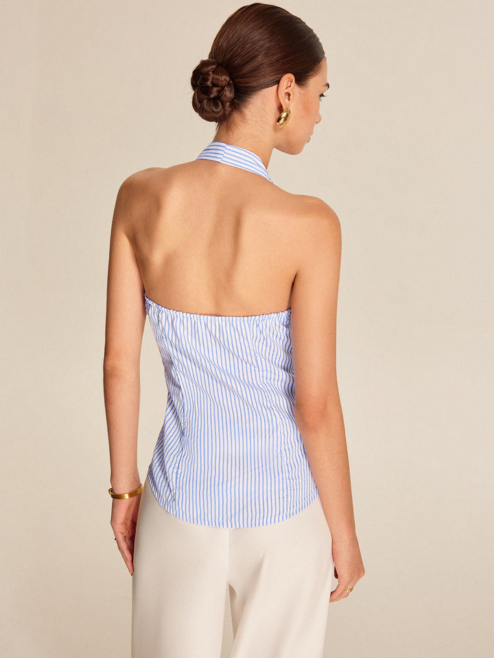 Women's light blue striped halter neck blouse, featuring a tie-front. Versatile sleeveless top for work & casual.