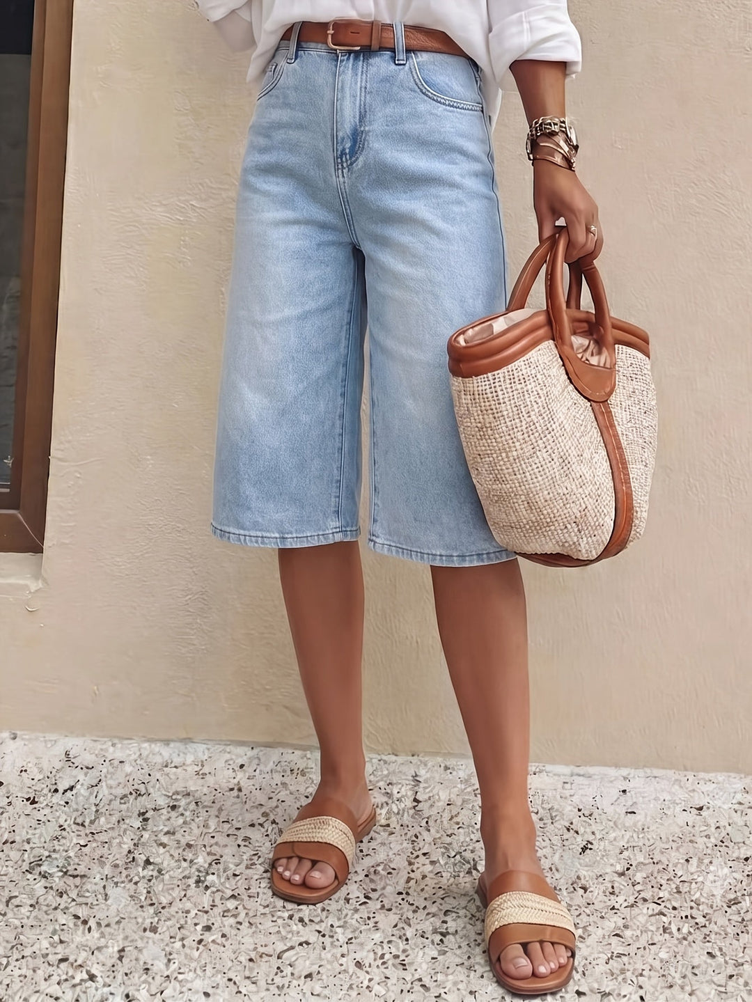 Model wearing light blue high waist wide leg culotte shorts, showcasing a comfortable, relaxed fit.