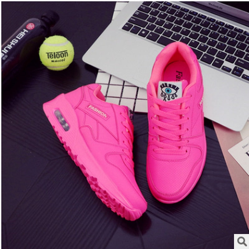 Stylish fuchsia pink women's platform sneakers, chunky design for a trendy fashion statement.