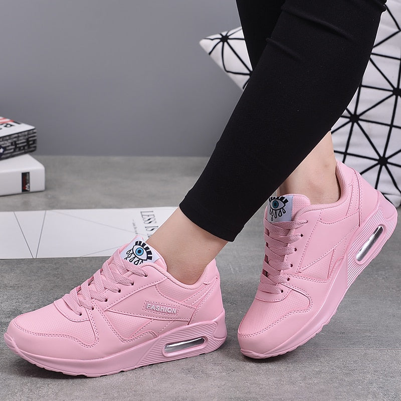 Women's light blue platform sneakers, stylish and comfortable casual footwear with a chunky sole.