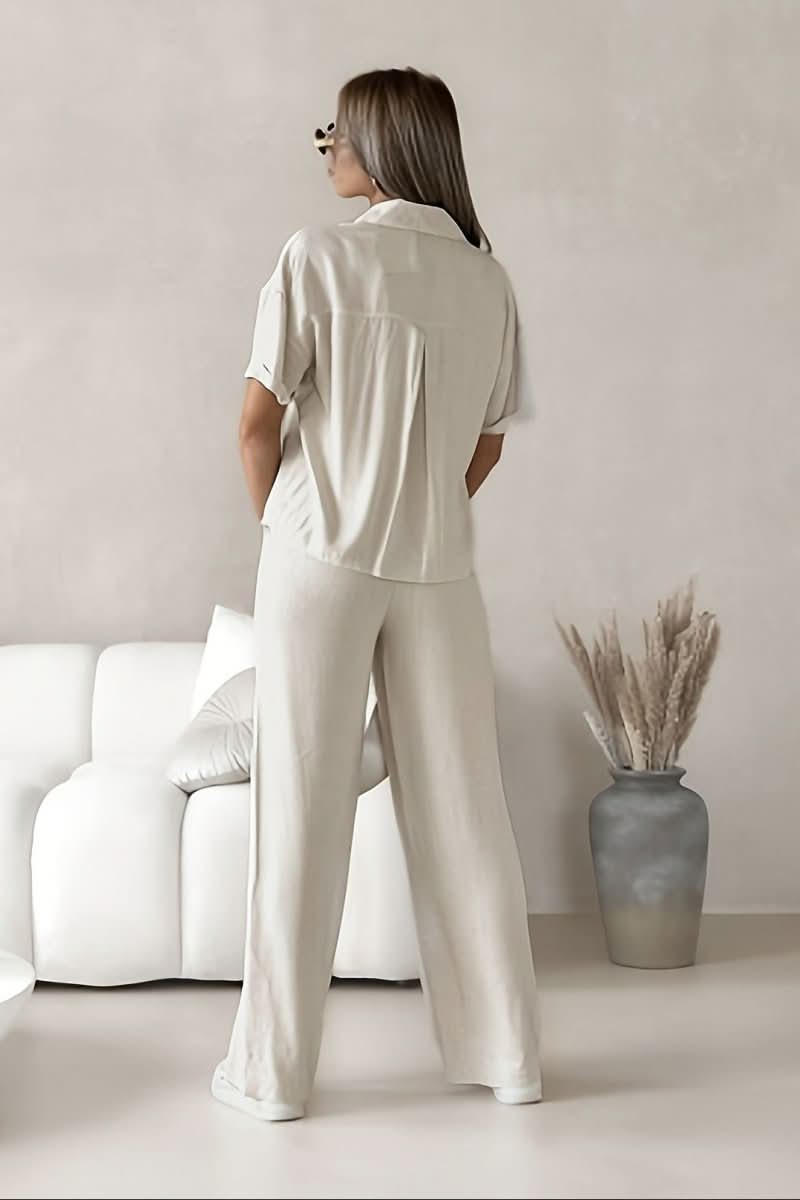 Modern white two-piece set for women, offering a versatile and chic minimalist style suitable for work or spring fashion.