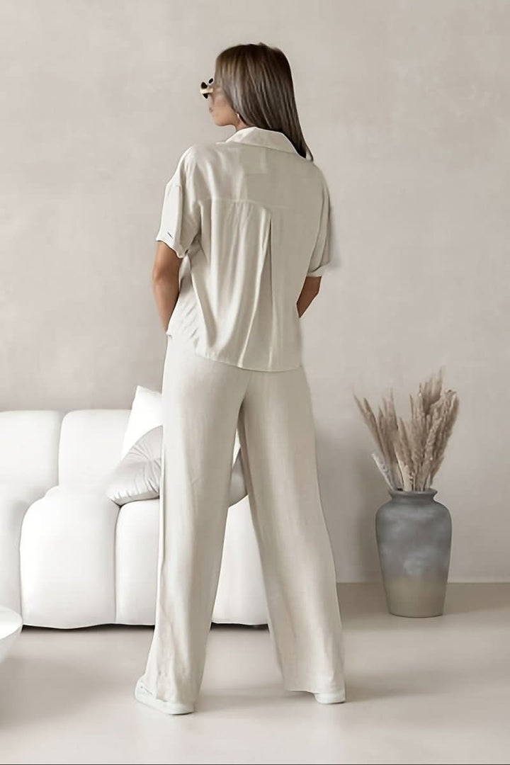 Modern white two-piece set for women, offering a versatile and chic minimalist style suitable for work or spring fashion.