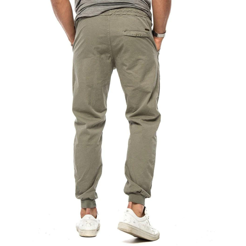 Close-up of lightweight, moisture-wicking men's linen joggers showing the flexible 4-way stretch fabric.