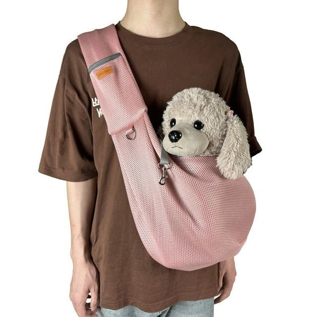 Unisex pet sling bag for small dogs, featuring a secure and breathable design for pet comfort