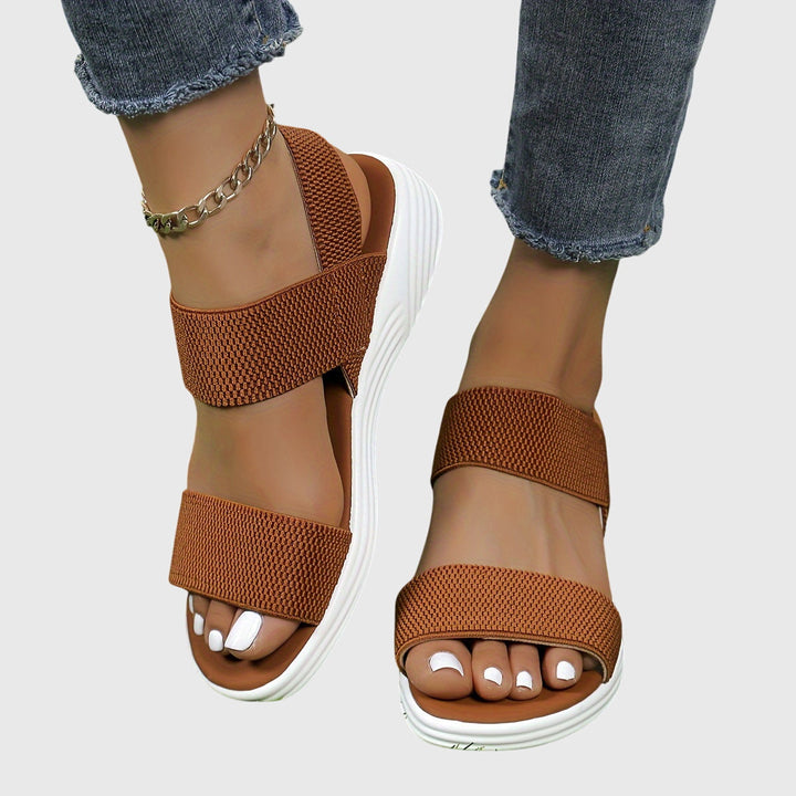 Comfortable women's orthopedic sandals, lightweight construction with adjustable arch support.