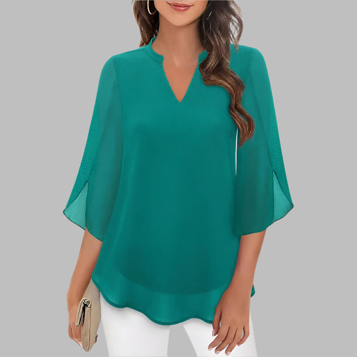 Elegant ladies' V-neck pullover top featuring chic petal sleeves, ideal lightweight casual wear for warm weather.