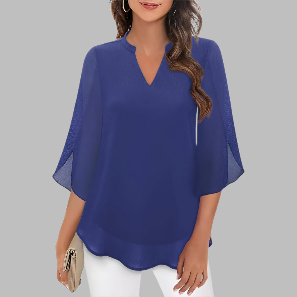 Elegant women's V-neck summer blouse with beautiful petal sleeves, a stylish and lightweight top for warm weather.